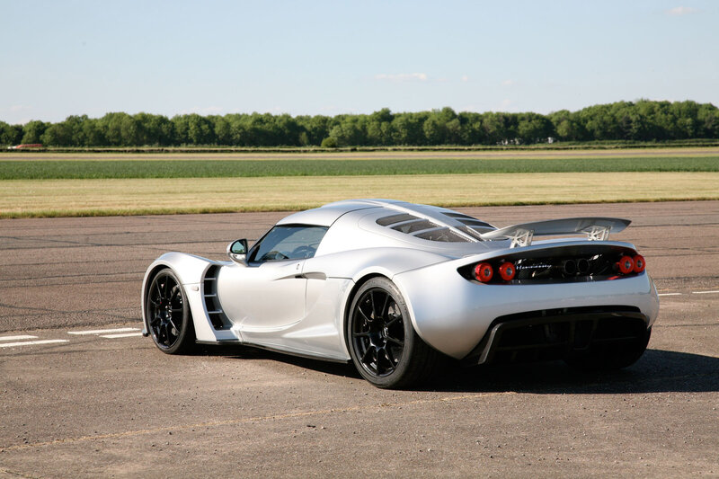 silver sports car on runway