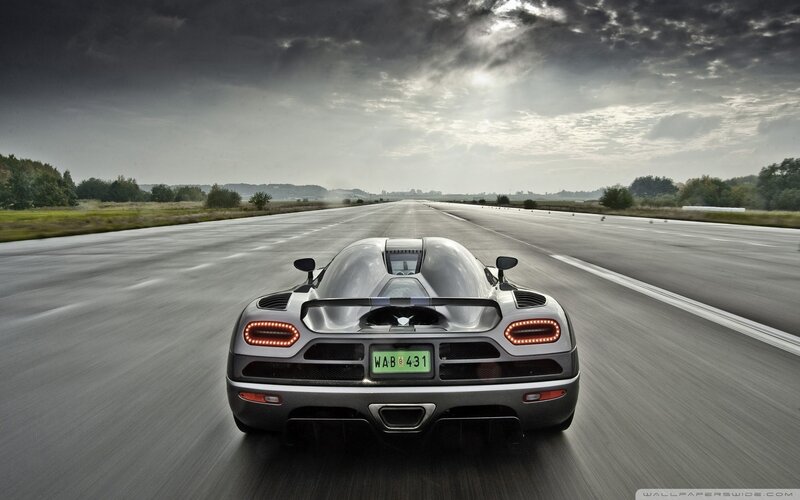 silver sports car on runway