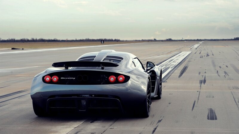 silver sports car on runway