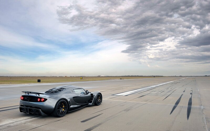 silver sports car on runway