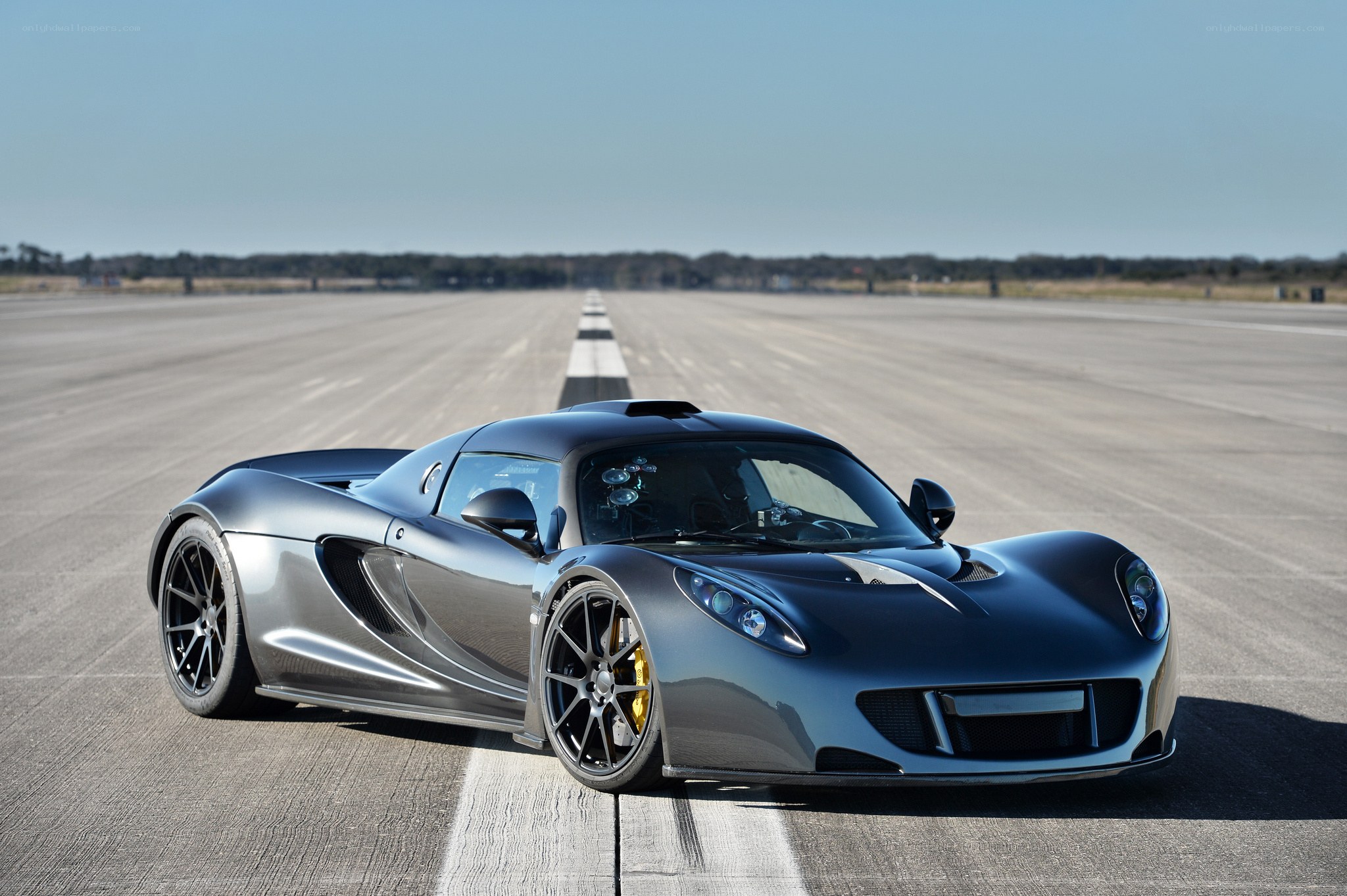 Silver sports car on runway
