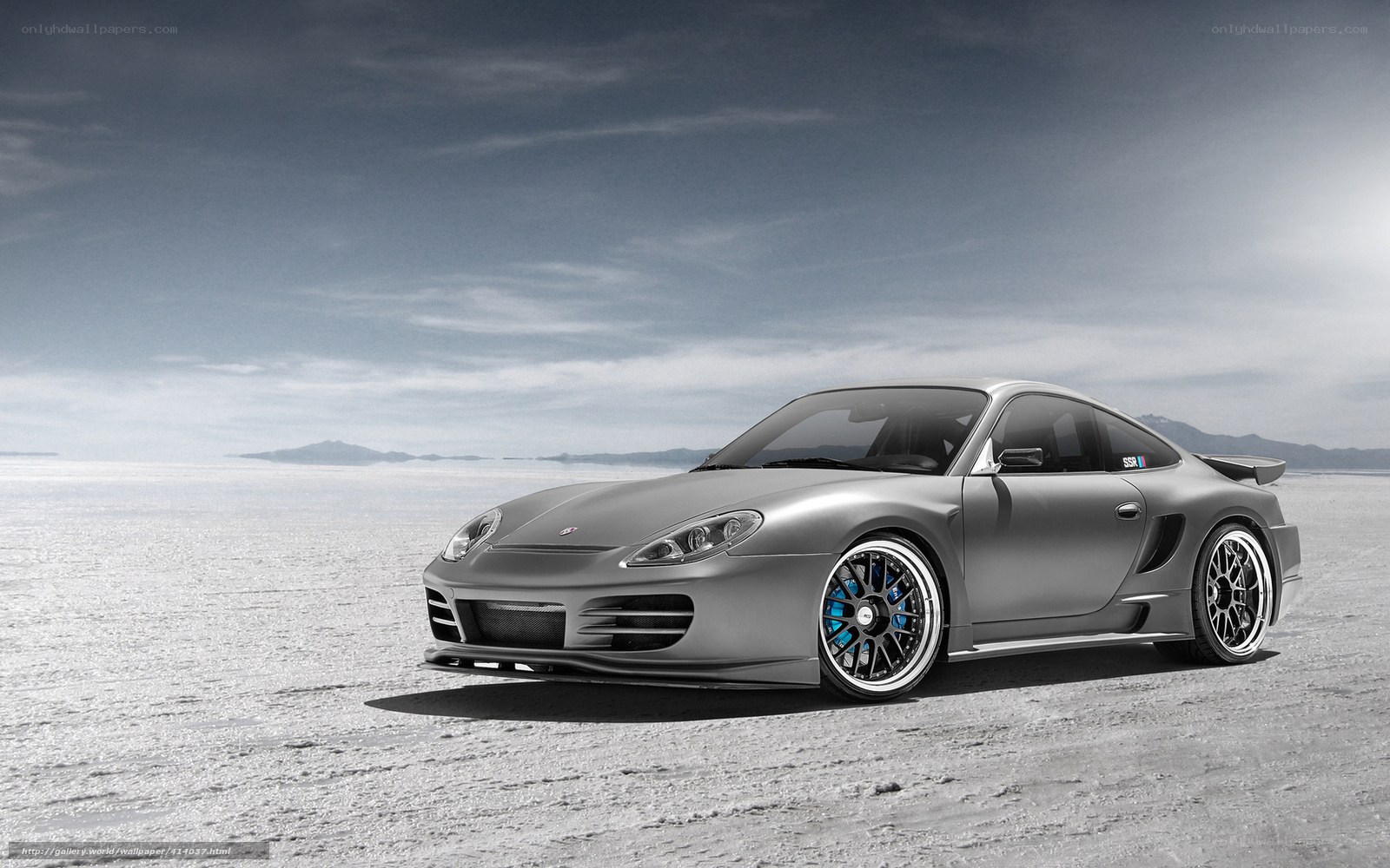 silver sports car on salt flat