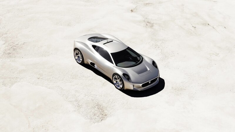 silver sports car on sand