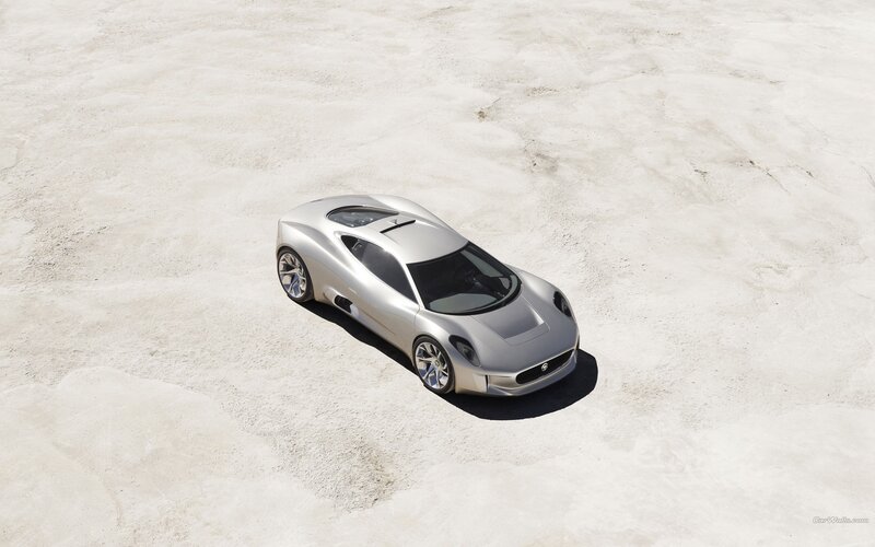 Silver sports car on sand