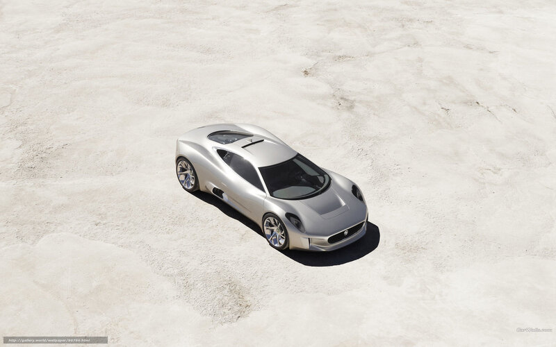 silver sports car on sand