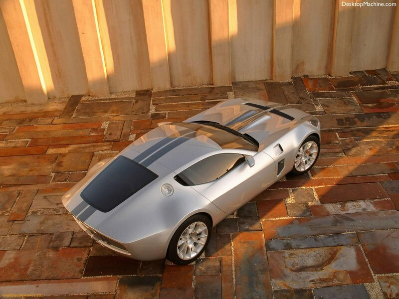 silver sports car on stone pavement