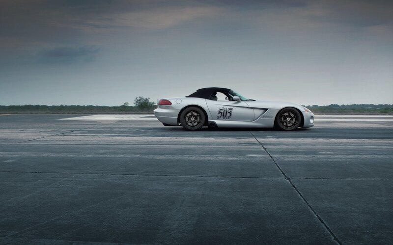 Silver sports car on tarmac