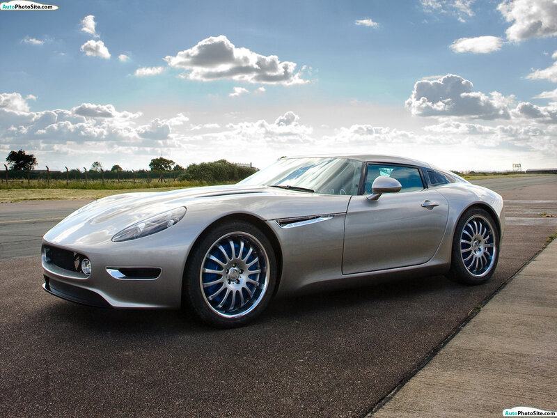 silver sports car on tarmac