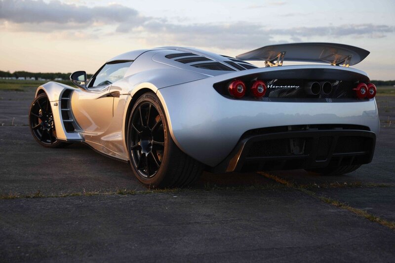 silver sports car on tarmac