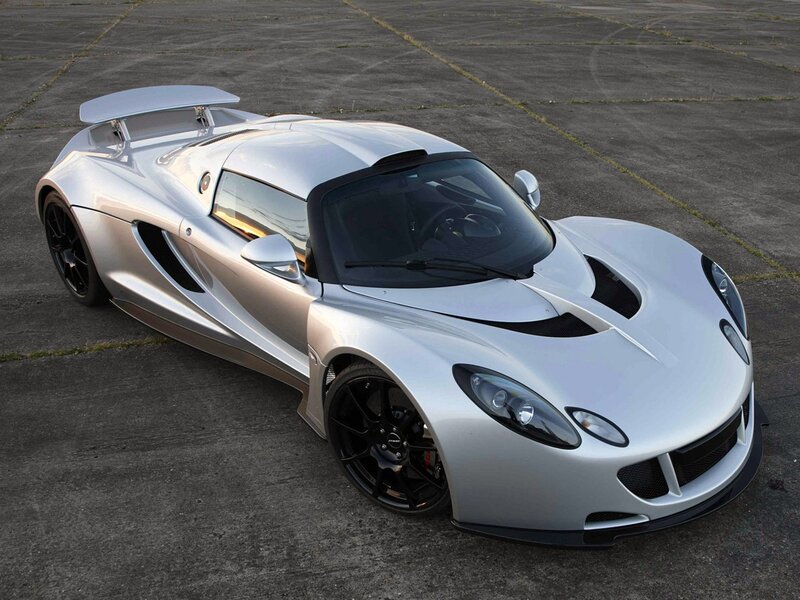 silver sports car on tarmac