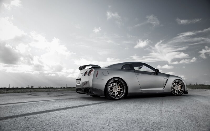 silver sports car on track