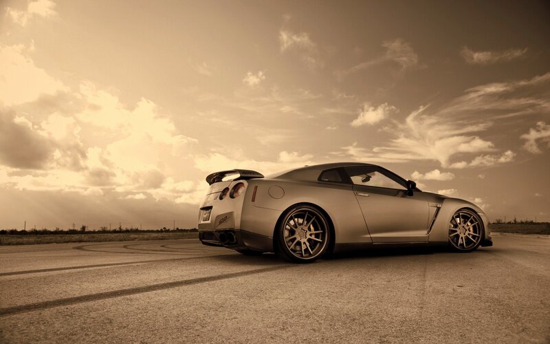 silver sports car on track