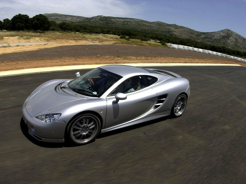 silver sports car on track