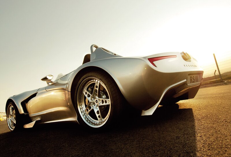 silver sports car on track