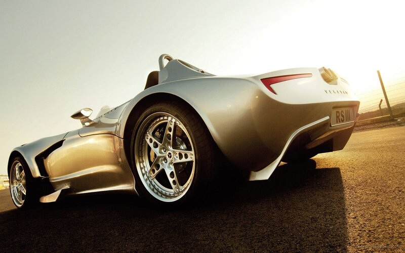 silver sports car on track