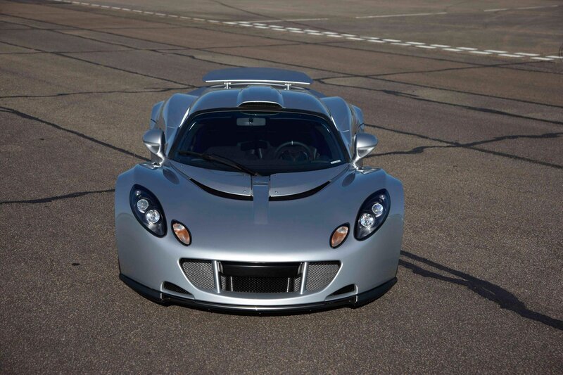 silver sports car on track