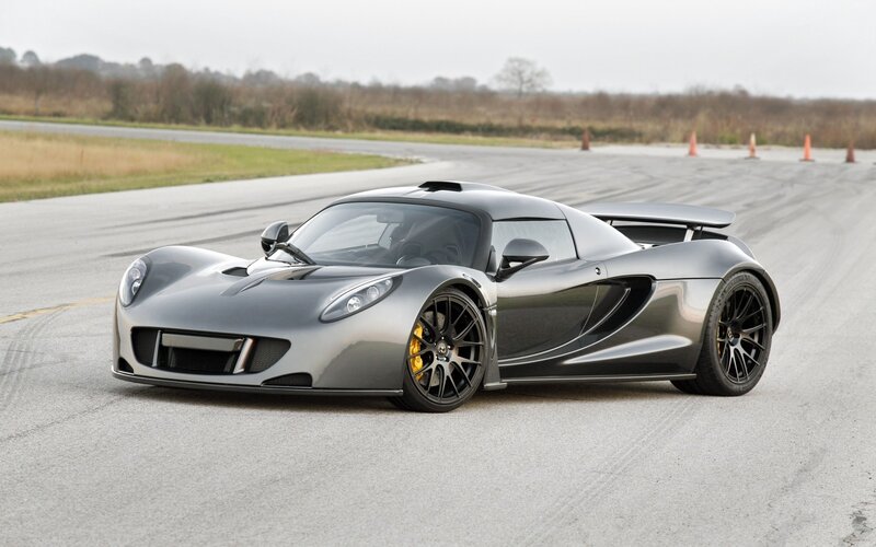 silver sports car on track