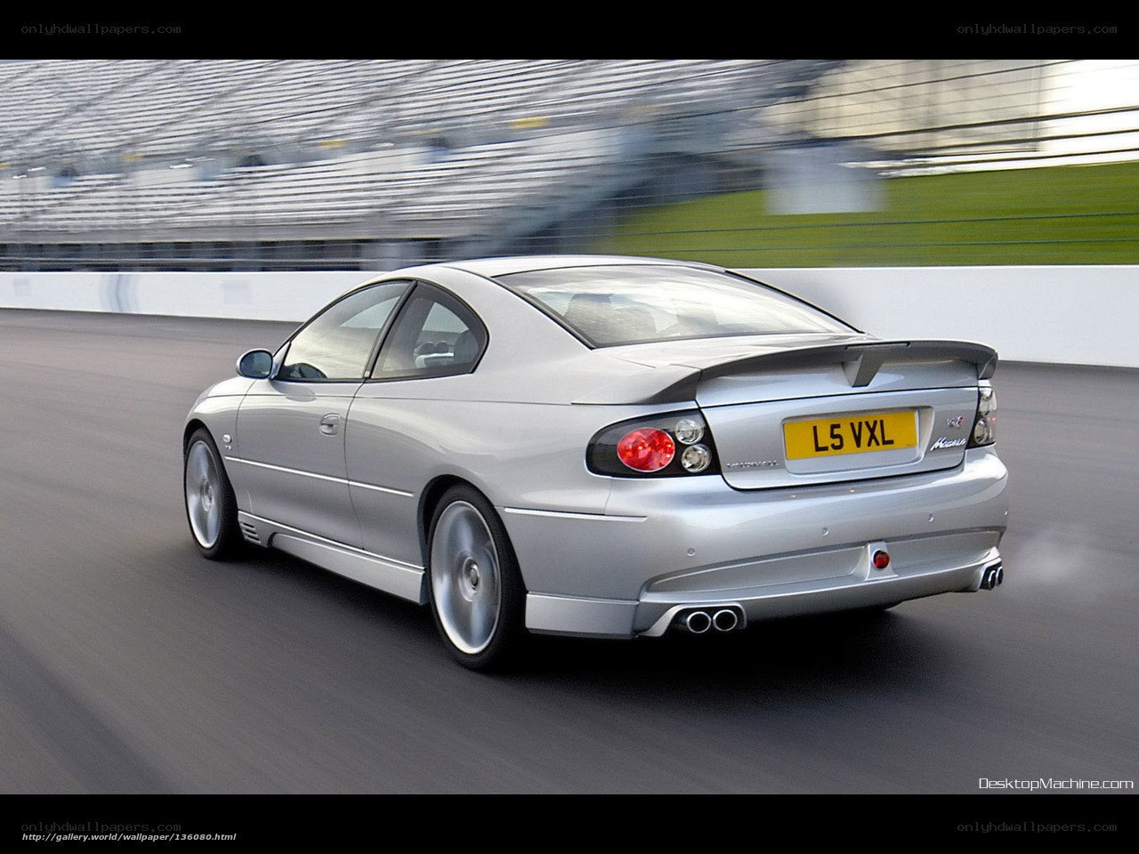 silver sports car on track