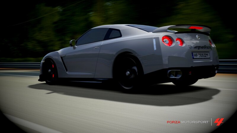 silver sports car on track