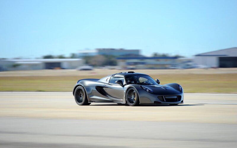 silver sports car on track