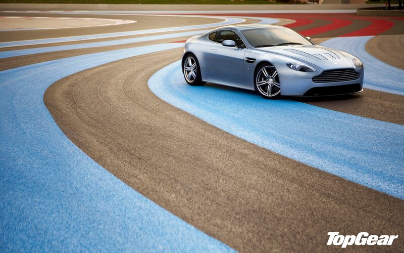silver sports car on track