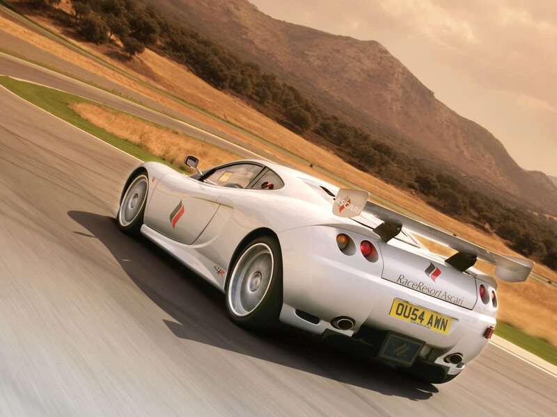 silver sports car on track