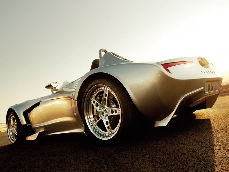 silver sports car on track