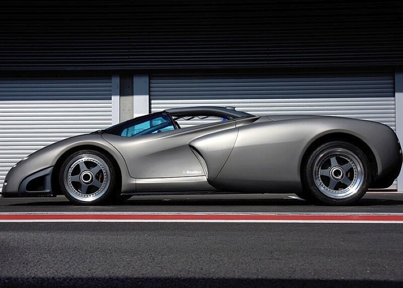 silver sports car on track