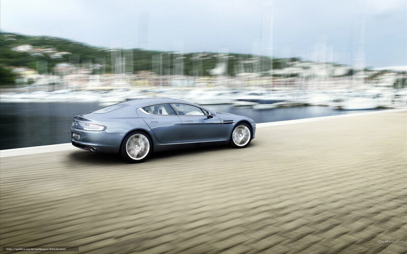 silver sports car on waterfront