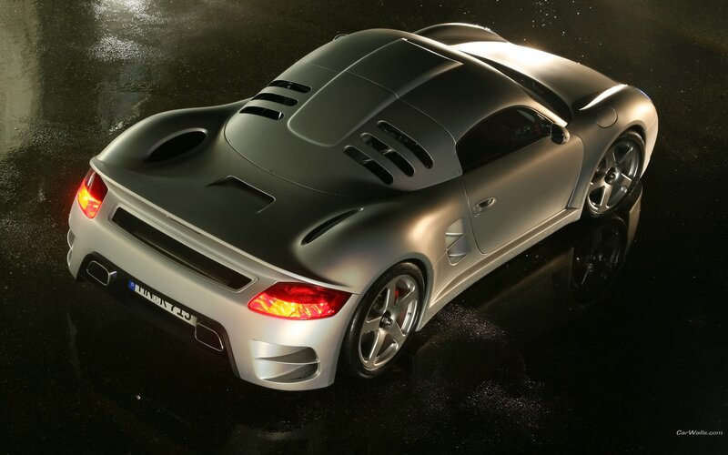 silver sports car on wet pavement
