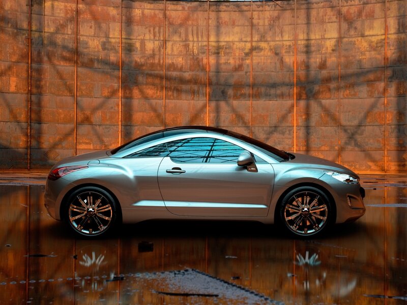 silver sports car on wet pavement