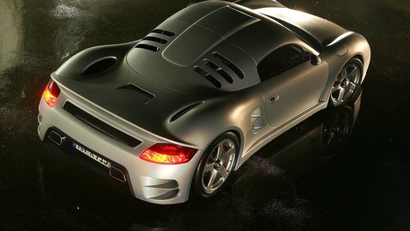 silver sports car on wet surface