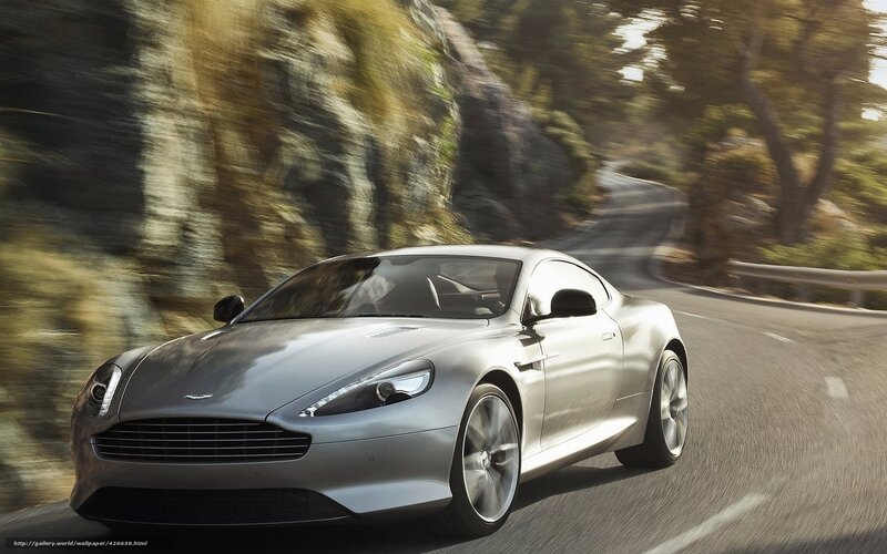 silver sports car on winding road