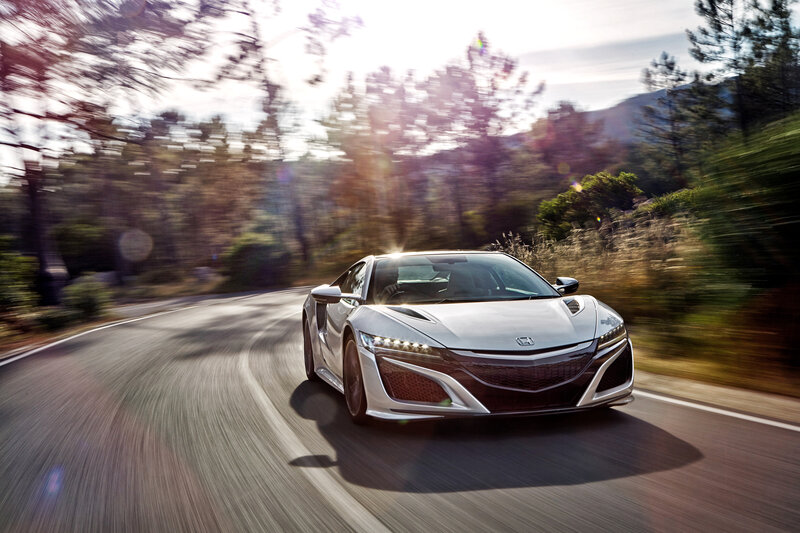 Silver sports car on winding road