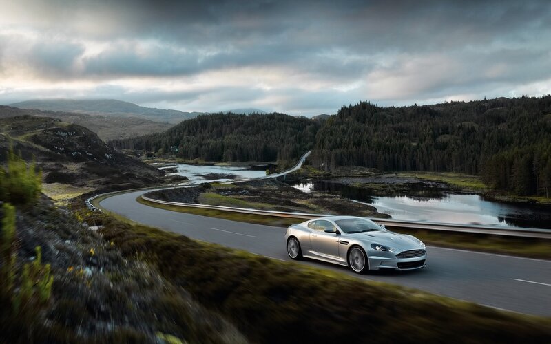 silver sports car on winding road