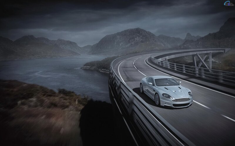 silver sports car on winding road