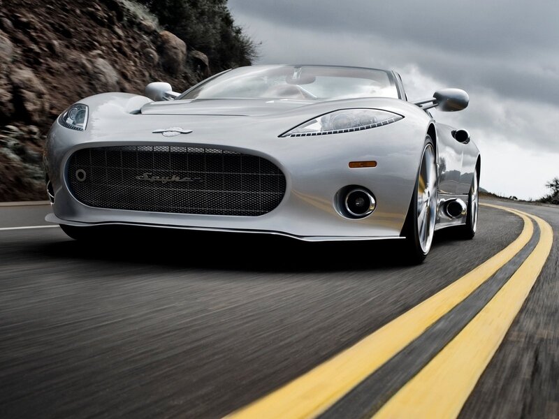 silver sports car on winding road