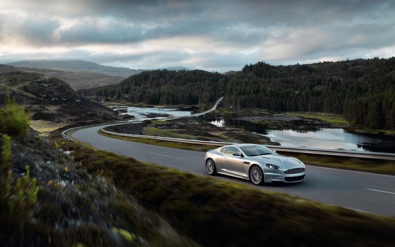 silver sports car on winding road