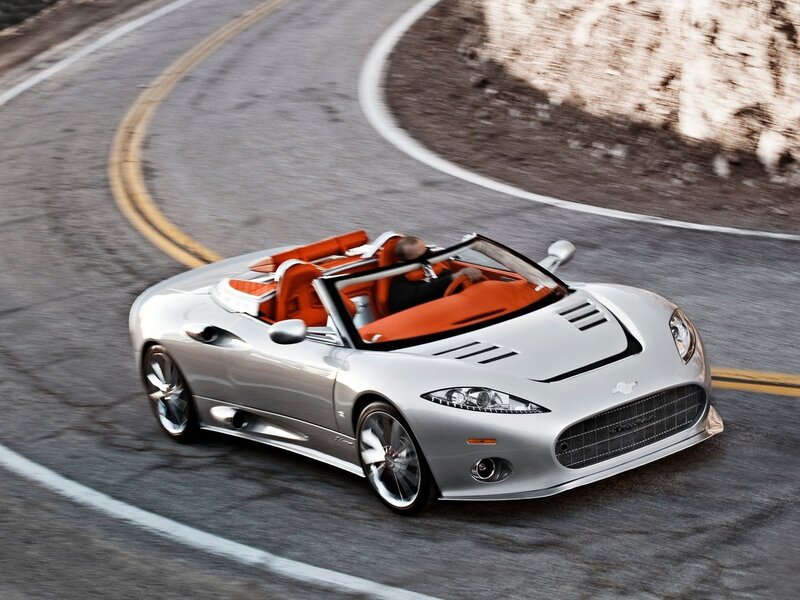 Silver sports car on winding road