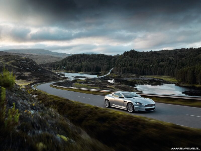 silver sports car on winding road
