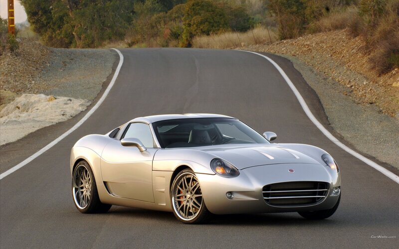 silver sports car on winding road