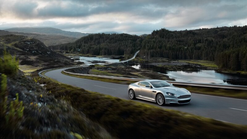 silver sports car on winding road