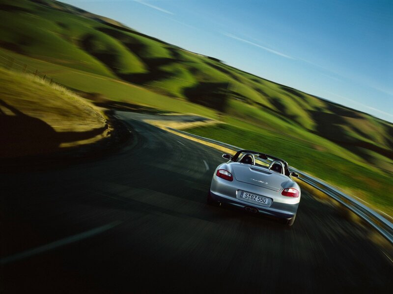 silver sports car on winding road