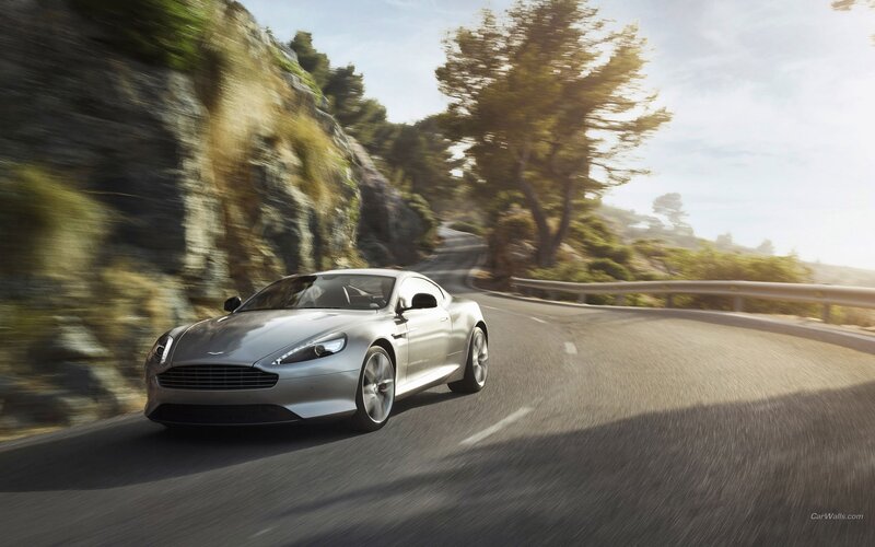 silver sports car on winding road