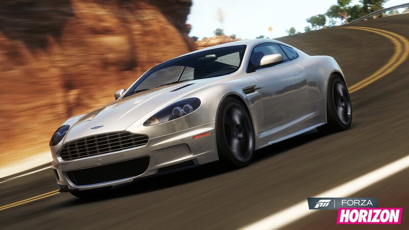 silver sports car on winding road