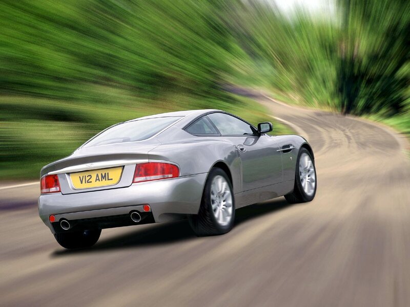 silver sports car on winding road