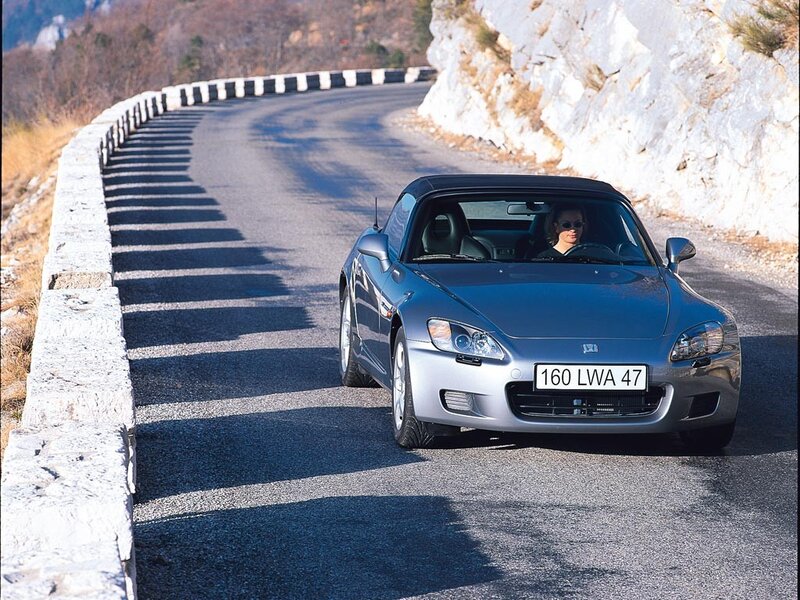 Silver sports car on winding road