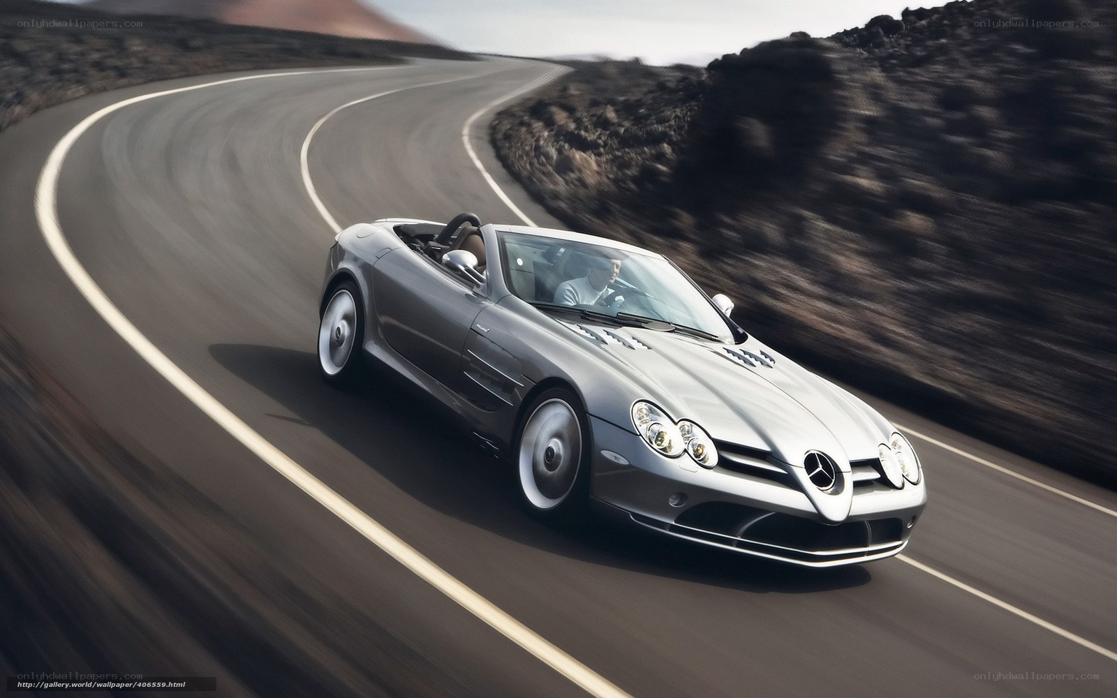 Silver sports car on winding road