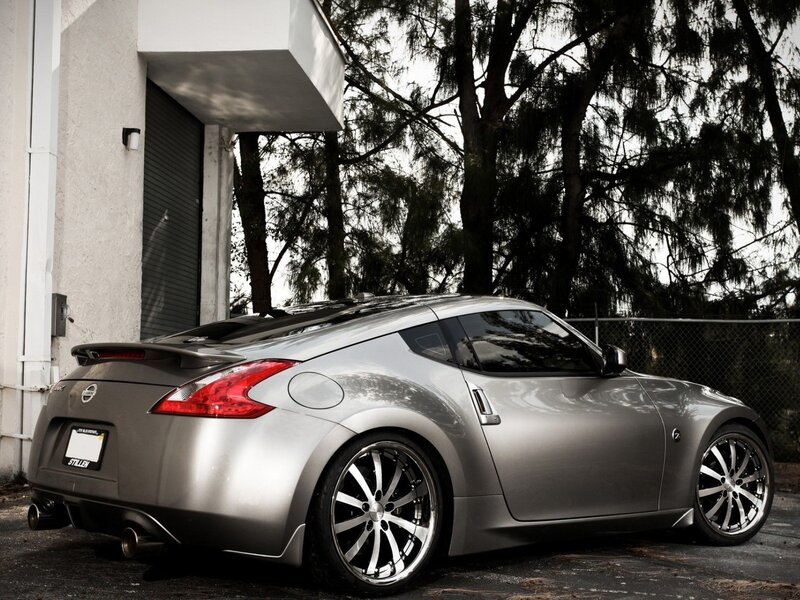silver sports car parked outside
