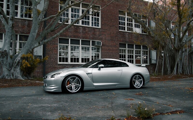 silver sports car parked outside